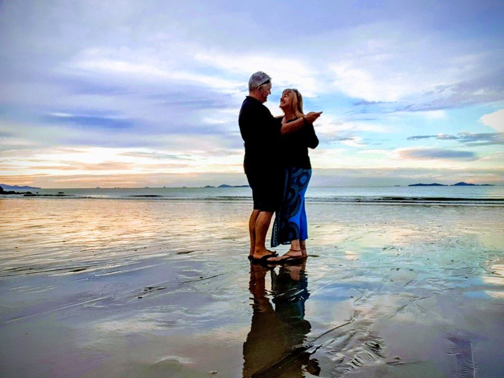 Dancing on the beach at sunset