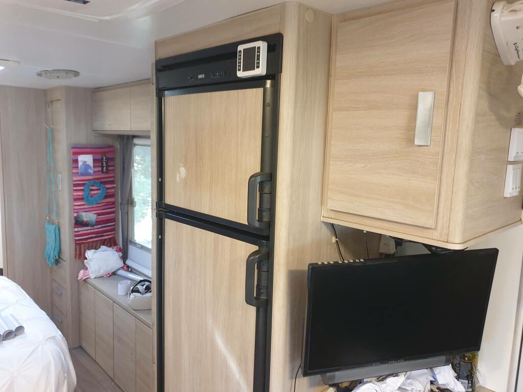 Caravan cupboards makeover. covering fridge door with brushed stainless steal contact paper