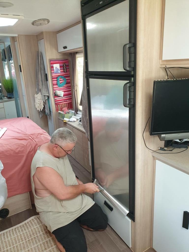 Caravan cupboards makeover. covering fridge door with brushed stainless steal contact paper
