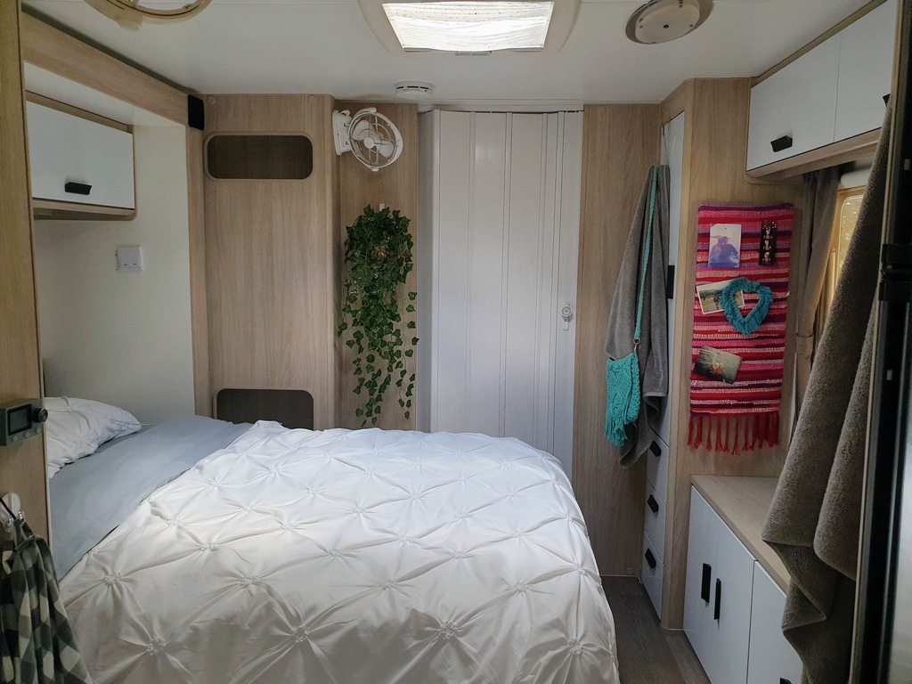 caravan cupboards makeover white oak wood concertina door for bathroom on-suite. keep caravan dooner on the bed stop it sliding off.