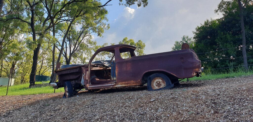 Mount Morgan Silver Wattle Caravan Park Queensland old rusty car in garden