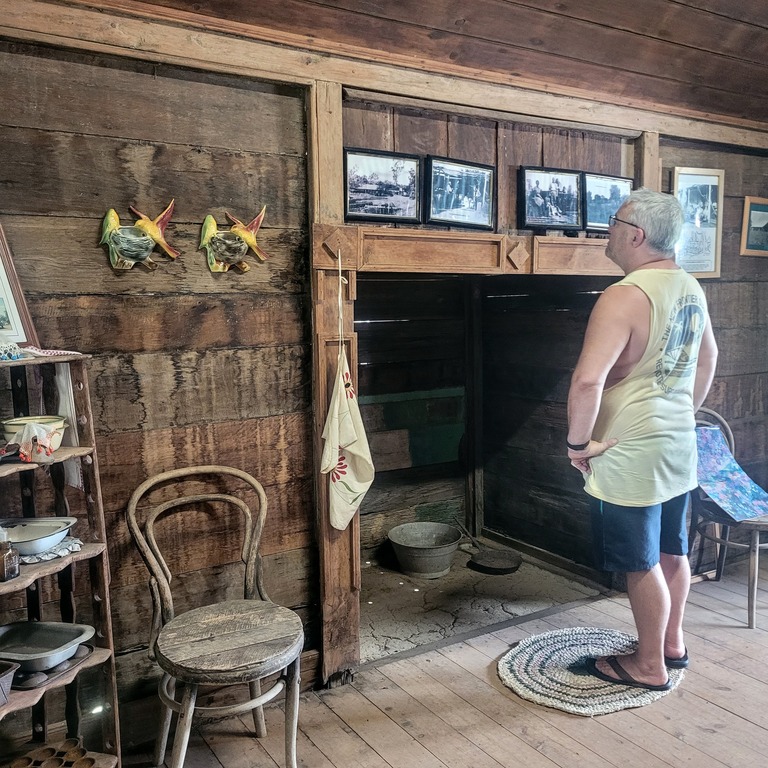 Man standing by Fire place at Historic Boondooma Homestead Qld