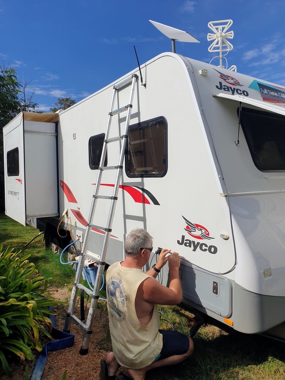 Starlink RV Internet Ethernet cable on caravan keeping the cord tidy with clips retractable ladder 