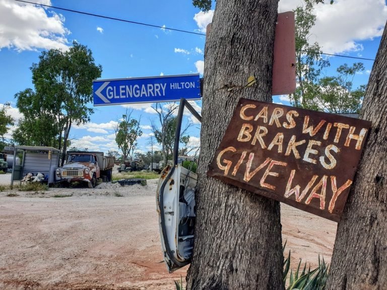 funny cars with brakes give way sign Outside the Sheepyard Inn pub Cumborah – NSW