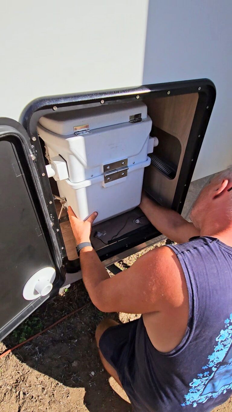 Larry taking out Natures Head Toilet